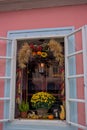 Delightful flower arrangement in front of the windows in the historical center of Prague, Czech Republic.