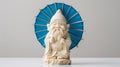 A delightful ivory-carved gnome, named 'gurka', stands proudly with a bright blue umbrella Royalty Free Stock Photo