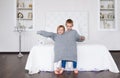 Delightful little children in big grey sweater. Royalty Free Stock Photo