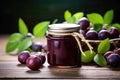 A delightful still life: glass jar filled with homemade plum jam and fresh plums Royalty Free Stock Photo