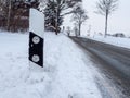Delineator posts on your road with snow