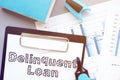 Delinquent loan is shown on the conceptual business photo