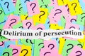 Delirium of persecution Syndrome text on colorful sticky notes Against the background of question marks