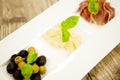 Deliscious antipasti plate with parma parmesan olives