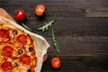 Delisious pepperoni pizza on the wooden table with copy space, top view