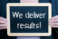 We deliver results - Businesswoman with chalkboard