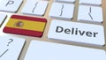 Deliver text and flag of Spain on the computer keyboard. Logistics related 3D rendering