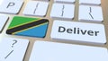 Deliver text and flag of Tanzania on the computer keyboard. Logistics related 3D rendering