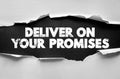 Deliver on your promises message shown in bold distressed lettering on torn paper. Symbolic text for trust, responsibility, Royalty Free Stock Photo