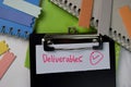 Deliverables text on paperwork isolated on office desk