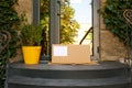 Delivered parcel on door mat Royalty Free Stock Photo