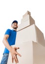 Deliverer keeps pile of cardboard boxes, bottom view