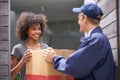 Delivering direct to your door. a courier making a delivery to a smiling customer.