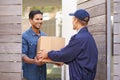 Delivering direct to your door. a young man making a home delivery.