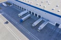 Delivering or Supply concept image. Trucks loading at facility. Logistics Center. Aerial View Royalty Free Stock Photo