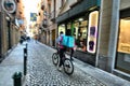 Deliveroo food delivery service runner at work downtown