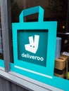 A Deliveroo restaurant window sign.  Deliveroo is an online food delivery company founded in 2013. Royalty Free Stock Photo