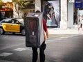 Delivery bag with multiple Amazon boxes while crossing busy street