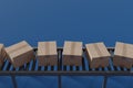 Delivery boxes move on a conveyor belt for logistics distribution, 3d rendering