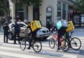 Delivery boys on bicycles in Paris, France