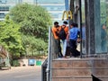 Delivery boys riders from companies like swiggy shadowfax zomato standing at a McDonalds takeaway for online food