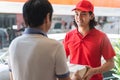 Delivery business service concept. Delivery Man sending packages to customer in front of house door