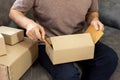 Delivery business Small and Medium EnterpriseSMEs Workers packaging box In Distribution Warehouse home office for shipping to Royalty Free Stock Photo