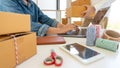 Delivery business Small and Medium EnterpriseSMEs Workers packaging box In Distribution Warehouse home office for shipping to Royalty Free Stock Photo