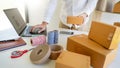 Delivery business Small and Medium EnterpriseSMEs Workers packaging box In Distribution Warehouse home office for shipping to Royalty Free Stock Photo