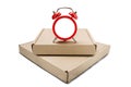 Delivery card boxes and red clock without dial on isolated white background with shadows. Concept of on time cargo and post delive Royalty Free Stock Photo