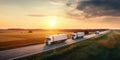 delivery cargo trucks driving in motion on highway road in country field and sunset landscape concept of lorry logistic
