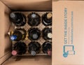 Delivery of case of wines from Naked Winery in cardboard box