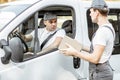 Delivery company employees delivering goods by car Royalty Free Stock Photo