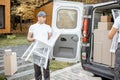 Delivery company employees unloading cargo van vehicle Royalty Free Stock Photo