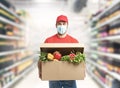 Delivery company worker holding grocery box, food order, supermarket service Royalty Free Stock Photo