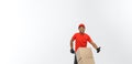 Delivery Concept - Portrait of Handsome African American delivery man or courier pushing hand truck with stack of boxes Royalty Free Stock Photo