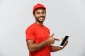 Delivery Concept - Portrait of Handsome African American delivery man or courier showing tablet on you to check the