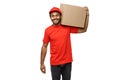 Delivery Concept - Portrait of Happy African American delivery man in red cloth holding a box package. Isolated on white Royalty Free Stock Photo