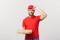 Delivery Concept: Young haapy caucasian Handsome Pizza delivery man holding pizza boxes isolated over grey background Royalty Free Stock Photo