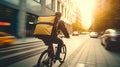 Delivery cyclist speeding through city streets at sunset, urban lifestyle Royalty Free Stock Photo