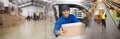 Composite image of delivery driver offering parcel from his van Royalty Free Stock Photo