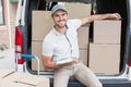 Delivery driver writing in clipboard