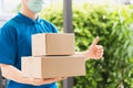 Delivery express courier young man use giving boxes to woman customer Royalty Free Stock Photo