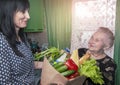 Delivery food during virus outbreak, coronavirus panic and pandemics. Stay safe at Home. Social worker helps retirees in the