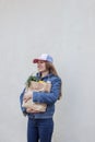 Delivery girl with kraft bag