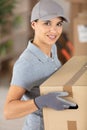 delivery girl wearing uniform holding box