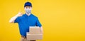 Delivery handsome man wearing and pointing mask with carton box picking up the package Royalty Free Stock Photo