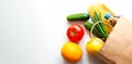 Delivery healthy food. Fresh vegetables and fruits in paper shopping bag on the table. Top view. Copy space. Banner Royalty Free Stock Photo