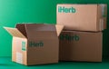 Delivery of Iherb vitamins by mail. Cardboard boxes with green logo. Open box. Shopping online