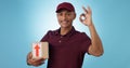 Delivery man, box and okay hands for success, product excellence and courier services in studio. Happy portrait of Royalty Free Stock Photo
